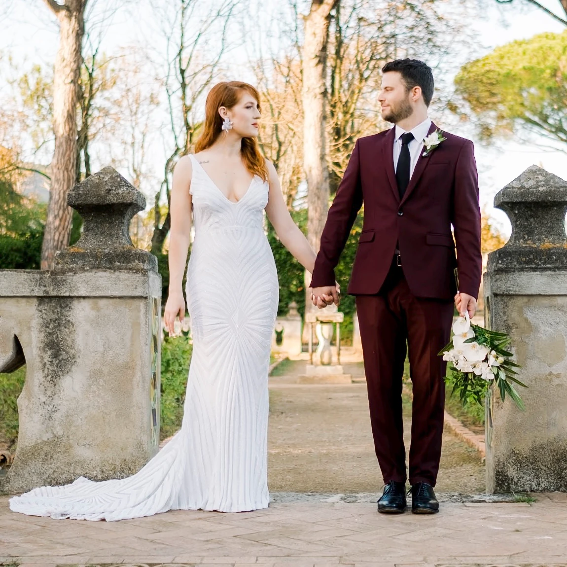 a newlywed couple in the gardens of Villa Cimbrone in Ravello